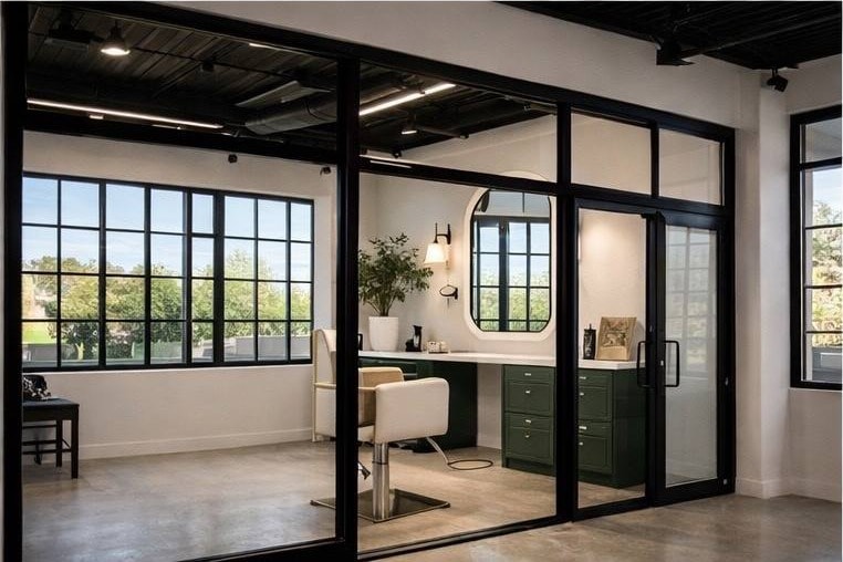 Rendering of a private suite with green cabinetry and mirror